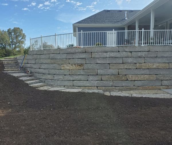 Boulder wall built by Mountainside Land Services.