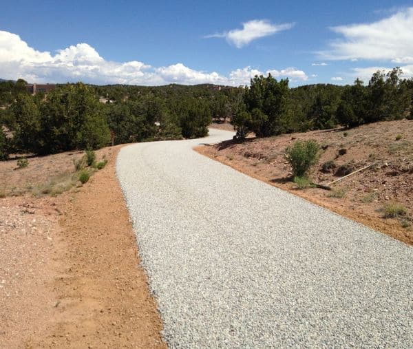 A winding gravel driveway on a hillside