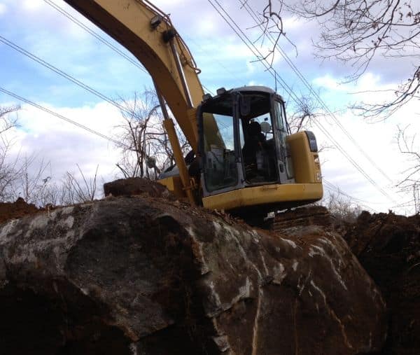 Mountainside Land Services prepping space for retaining wall.